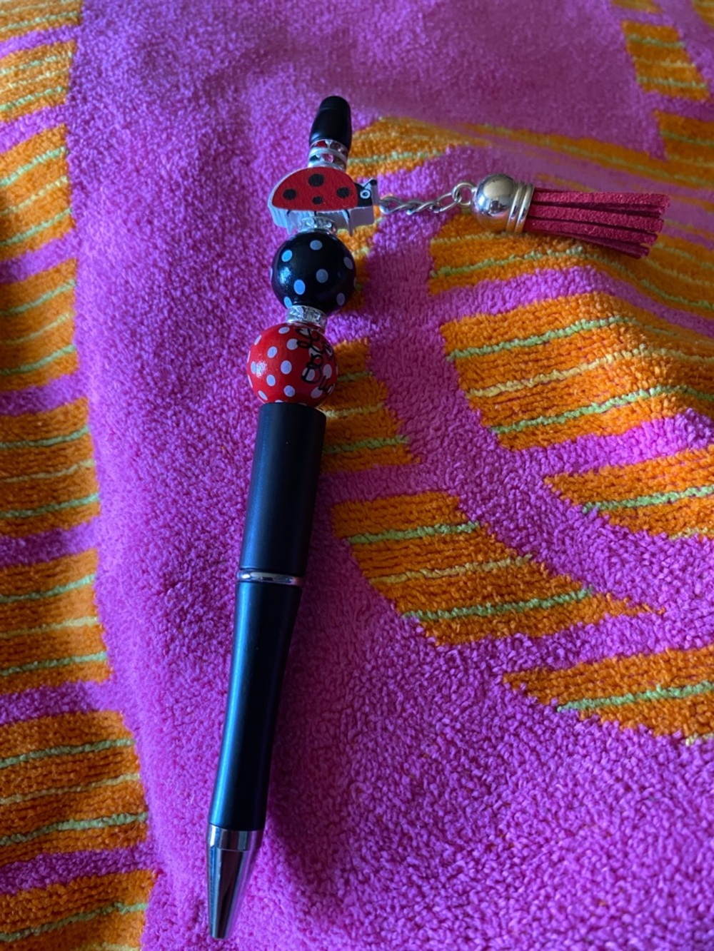 Black pen lady bug love bug and red tassel with Red and Black Polka Dot Accents
